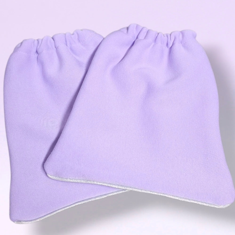 A pair of Lavender soft knit stirrup socks with elasticized cuffs, and light silver shimmer piping, shown overlapping on a light lavender background.