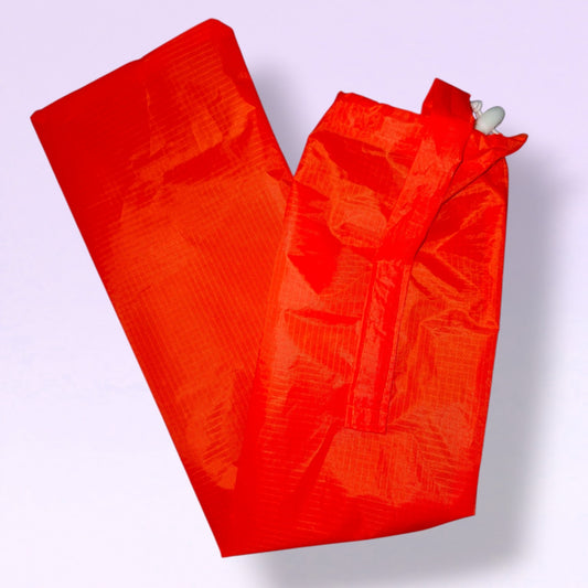 Hi vis/ fluoro orange tail bag on a light coloured background 