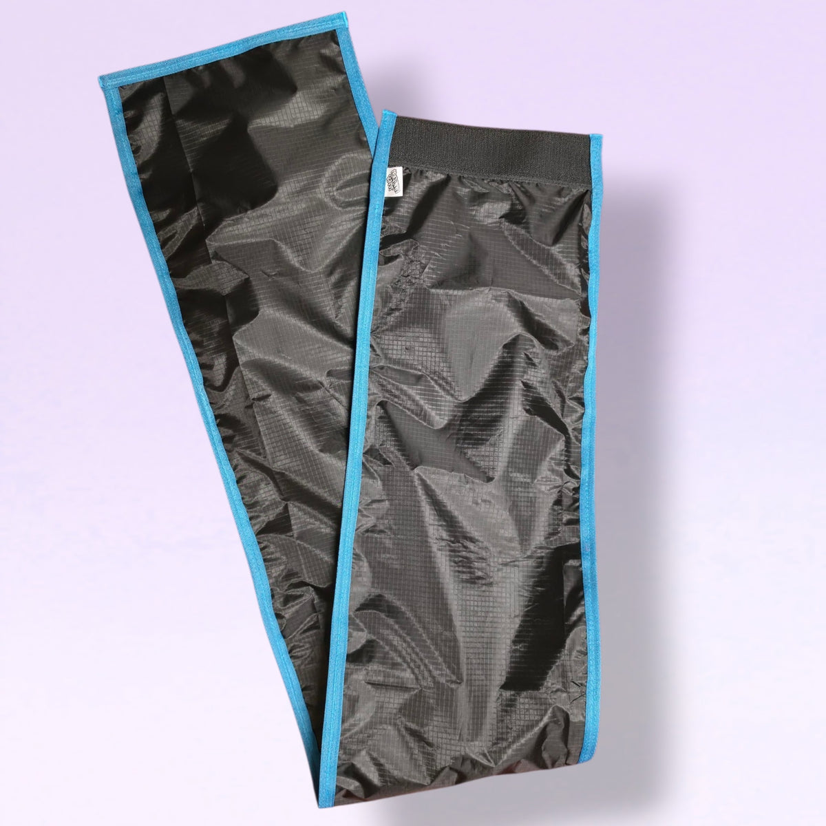 Picture of the back of a Jaded Unicorn Rugged FeatherLite Tail Bag in colour Black with Electric Blue trim 