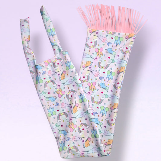 Swish Slinky tail bag in Peen-icorn print with pink tassels